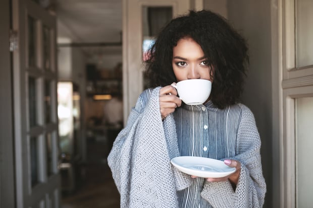 woman drinking a cup of vanilla chai tea