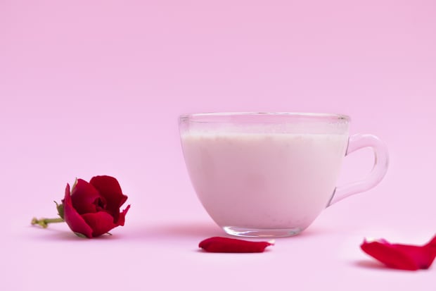 a cup of pink rose milk tea