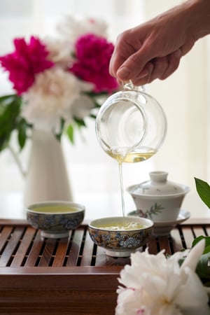 serving cups of white peony tea